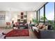 Bright living room filled with vintage decor and floor-to-ceiling windows at 145 15Th Ne St # 843, Atlanta, GA 30309