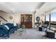 Cozy living room with a blue sofa, glass coffee table, and an decorative hutch for refined entertaining at 145 15Th Ne St # 843, Atlanta, GA 30309
