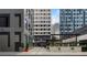 Charming outdoor dining area with string lights and comfortable seating, surrounded by modern architecture at 145 15Th Ne St # 843, Atlanta, GA 30309
