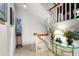 Stairway decorated with plants, a glass-topped table, and decorative vases at 145 15Th Ne St # 843, Atlanta, GA 30309