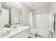 Bright bathroom with a single sink, white cabinets, and a shower-tub combination at 1925 Meyers Dr, Lawrenceville, GA 30045