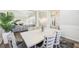 Open-concept dining area features modern furnishings, hardwood flooring, and seamlessly connects to the living space at 1925 Meyers Dr, Lawrenceville, GA 30045