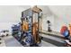 Home gym equipped with exercise bike and multi-function strength training equipment at 1925 Meyers Dr, Lawrenceville, GA 30045