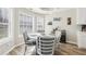 Eat-in kitchen area features hardwood floors, pendant lighting, quartz countertops, and light gray walls at 1925 Meyers Dr, Lawrenceville, GA 30045