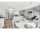 Open concept eat-in kitchen and living room features stainless steel appliances and hardwood flooring at 1925 Meyers Dr, Lawrenceville, GA 30045