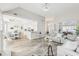 Bright living room boasts modern light fixture, hardwood floors, and neutral paint throughout at 1925 Meyers Dr, Lawrenceville, GA 30045