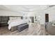Spacious main bedroom features hardwood floors, neutral paint, tray ceiling, and ensuite bath at 1925 Meyers Dr, Lawrenceville, GA 30045