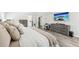 Beautiful main bedroom featuring a large bed, a TV, ample closet space, and hardwood floors at 1925 Meyers Dr, Lawrenceville, GA 30045