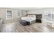 Spacious main bedroom featuring hardwood floors, neutral paint, and tray ceiling at 1925 Meyers Dr, Lawrenceville, GA 30045