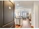 Inviting entryway showcasing hardwood floors, a modern kitchen, and a glimpse of the living area at 2277 Peachtree Ne Rd # 608, Atlanta, GA 30309