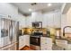 Elegant kitchen with stainless steel appliances, wood floors, and granite counters at 2277 Peachtree Ne Rd # 608, Atlanta, GA 30309