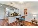 Modern kitchen with stainless steel appliances, black countertops, and an adjacent dining area at 2277 Peachtree Ne Rd # 608, Atlanta, GA 30309