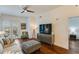 Bright living room with hardwood floors, a balcony view, and modern furniture at 2277 Peachtree Ne Rd # 608, Atlanta, GA 30309