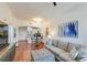 Bright living room with hardwood floors, open to dining area, kitchen, and complete with comfortable sofa seating at 2277 Peachtree Ne Rd # 608, Atlanta, GA 30309