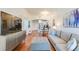 Open-concept living area with hardwood floors, comfortable seating, and a view of the kitchen at 2277 Peachtree Ne Rd # 608, Atlanta, GA 30309