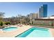 A stunning pool and hot tub with cityscape views offer a luxurious oasis for relaxation and recreation at 2277 Peachtree Ne Rd # 608, Atlanta, GA 30309