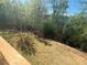 Overhead view of backyard from deck with surrounding trees at 630 Gilles Ln, Cumming, GA 30041