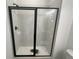 Bathroom shower with glass doors and marble tiling at 630 Gilles Ln, Cumming, GA 30041