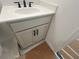 Bathroom vanity with white countertop and a gray cabinet at 630 Gilles Ln, Cumming, GA 30041