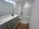 Well-lit bathroom features a double sink and tub at 630 Gilles Ln, Cumming, GA 30041