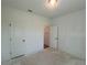 Empty bedroom with a closet and a door to the right at 630 Gilles Ln, Cumming, GA 30041