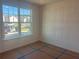 Bedroom with large window offering neighborhood views and plenty of natural light at 630 Gilles Ln, Cumming, GA 30041