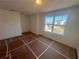 Bright bedroom filled with natural light from a large window with view of neighborhood, offering a cozy retreat at 630 Gilles Ln, Cumming, GA 30041