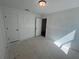 Clean, spacious bedroom with two doors, neutral walls, and ample natural light at 630 Gilles Ln, Cumming, GA 30041