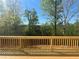Wooden deck showcasing a beautiful view of the surrounding trees at 630 Gilles Ln, Cumming, GA 30041