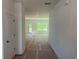 Bright hallway leading to a spacious living area, with natural light pouring in through the windows at 630 Gilles Ln, Cumming, GA 30041