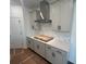 Kitchen with modern cabinets, stainless steel appliances, sleek countertops and modern hardware at 630 Gilles Ln, Cumming, GA 30041