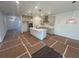 Spacious kitchen with a large island, stainless steel appliances, and modern lighting fixtures at 630 Gilles Ln, Cumming, GA 30041