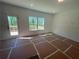 Spacious living room with deck access and large windows offering picturesque views at 630 Gilles Ln, Cumming, GA 30041