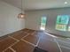 Bright living room featuring a door to the deck and a large window showcasing scenic views at 630 Gilles Ln, Cumming, GA 30041
