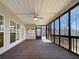 Spacious screened-in back porch with ceiling fan and wooden flooring at 9585 Grande Dr, Winston, GA 30187