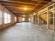 Unfinished basement with exposed ceiling beams and natural light at 9585 Grande Dr, Winston, GA 30187