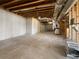 Unfinished basement with concrete floor and exposed ductwork at 9585 Grande Dr, Winston, GA 30187