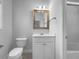 Bathroom featuring a single sink vanity, framed mirror and tile floors at 9585 Grande Dr, Winston, GA 30187