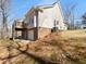 Exterior view of the home with attached back deck and brick accents at 9585 Grande Dr, Winston, GA 30187