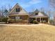 Charming one-story brick home with green shutters and well-maintained landscaping at 9585 Grande Dr, Winston, GA 30187