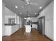 Kitchen featuring white cabinetry, stainless steel appliances, and granite countertops at 9585 Grande Dr, Winston, GA 30187