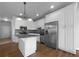 Kitchen with stainless steel appliances, island and sleek countertops at 9585 Grande Dr, Winston, GA 30187