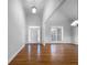 Spacious living room with gleaming hardwood floors and white trim at 9585 Grande Dr, Winston, GA 30187