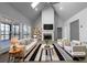 Bright living room featuring vaulted ceiling, fireplace, and large windows at 9585 Grande Dr, Winston, GA 30187