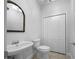 Powder room featuring a pedestal sink and tile floors at 9585 Grande Dr, Winston, GA 30187