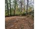 Fenced backyard with mature trees providing shade and privacy at 2061 Detroit Nw Ave, Atlanta, GA 30314