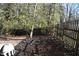 Fenced backyard featuring mature trees providing shade and privacy at 2061 Detroit Nw Ave, Atlanta, GA 30314