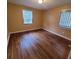 Bedroom with two windows and hardwood floors at 2061 Detroit Nw Ave, Atlanta, GA 30314