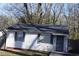 Cozy single-story house featuring a well-maintained yard, vinyl siding, and security doors at 2061 Detroit Nw Ave, Atlanta, GA 30314