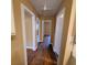 Hallway with wood floors leading to kitchen and bedrooms at 2061 Detroit Nw Ave, Atlanta, GA 30314